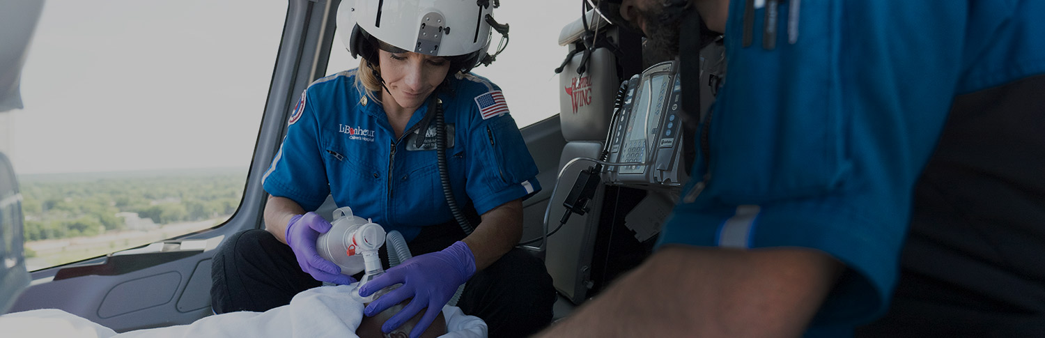 A neonatal/pediatric respiratory therapist in flight